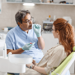 Dentist talking to patient about tooth extractions