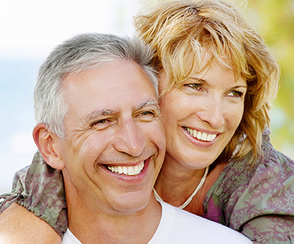 Older couple with happy healthy smiles