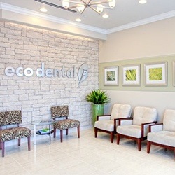 Smiling older couple at reception desk