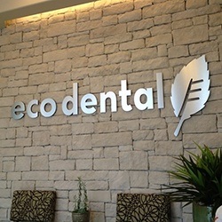 Eco Dental sign on office wall
