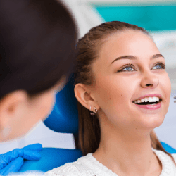 Woman having tooth removed