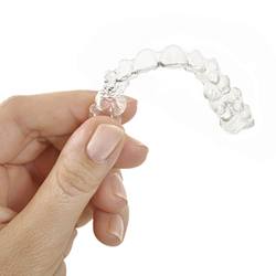 Woman holding Invisalign