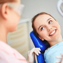 Young woman smiling in dental chair