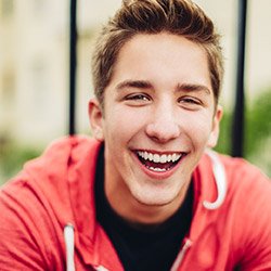 Laughing young man with healthy smile