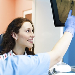 Dentist and patient looking at x-rays