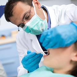 Dentist treating relaxed patient