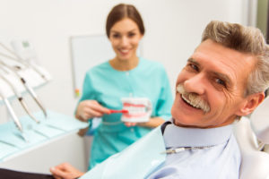 Senior man smiling in dental chair