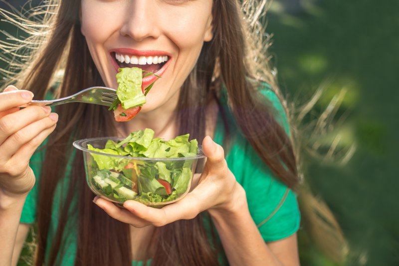 girl eating salad on vegan diet