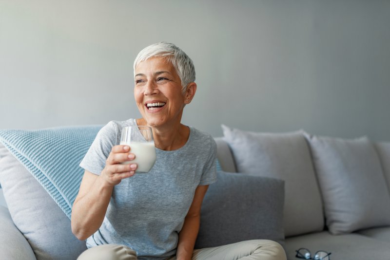 woman smiling with dental implants in Sugar Land